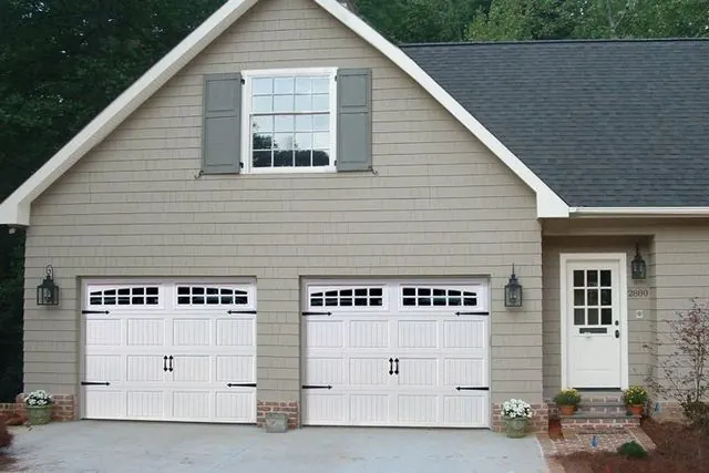 Raynor Aspen garage doors on a two-story home