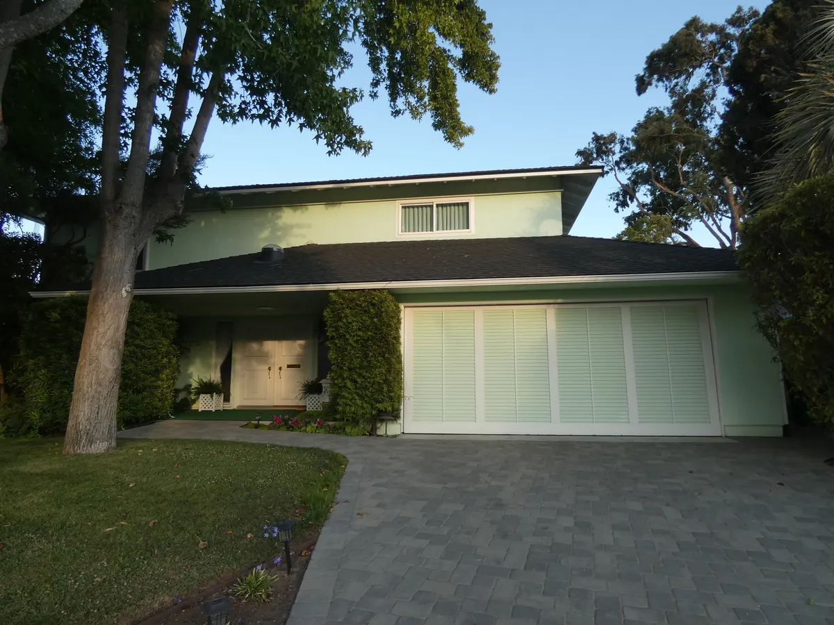 California home with a wide light garage door